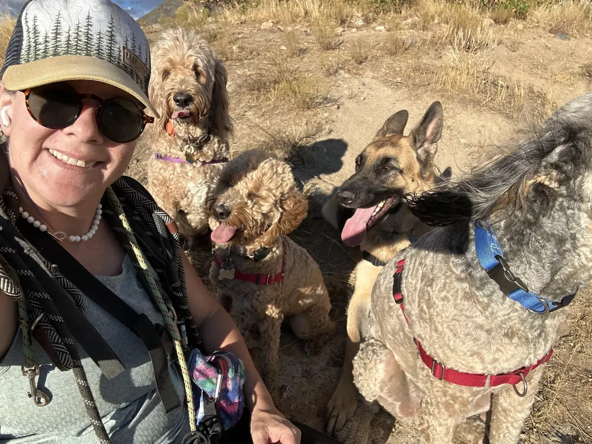 Shanti with three dogs outdoors
